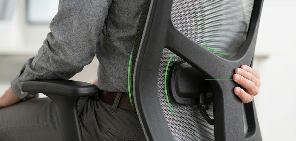 Close-up of a user adjusting an ergonomic backrest mechanism, demonstrating the correct height and technique for where to place lumbar support on chair models.