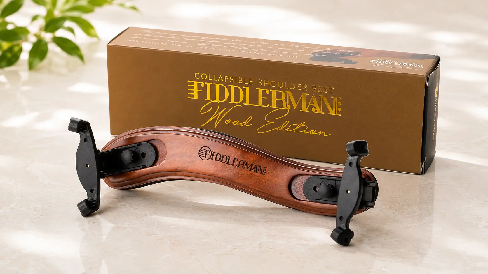 Fiddlerman Wood Edition violin shoulder rest with varnished wood frame next to retail box